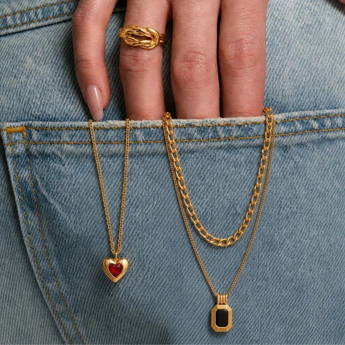 Eternal Knot Ring, Blush Heart Necklace and Midnight Onyx Layered Necklace styled on a model