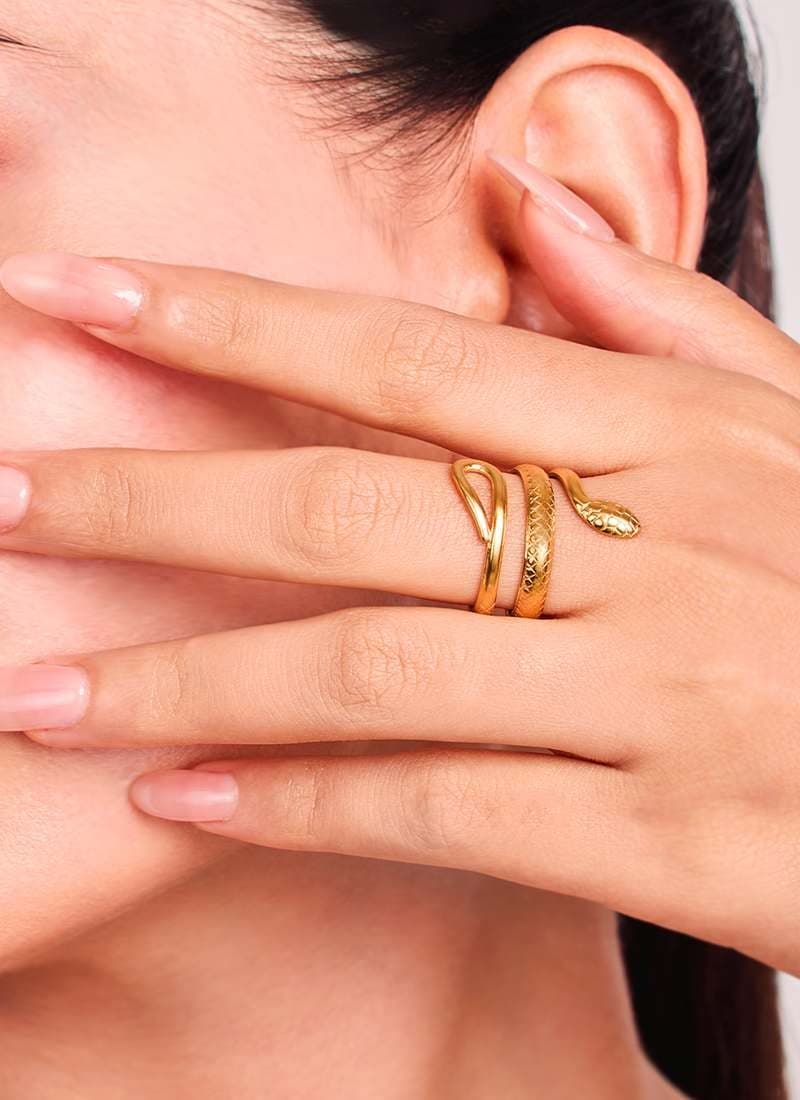 Woman wearing Golden Serpent Ouro Ring gold snake statement ring