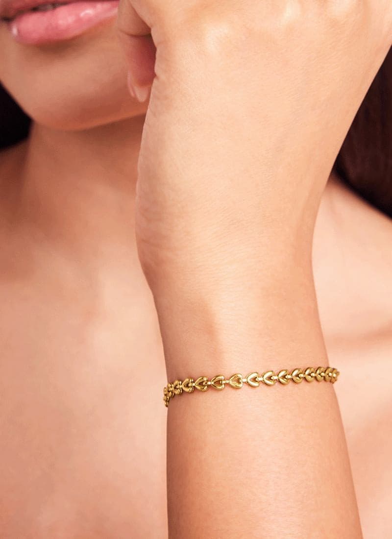 18k gold plated linked hearts bracelet by Elra