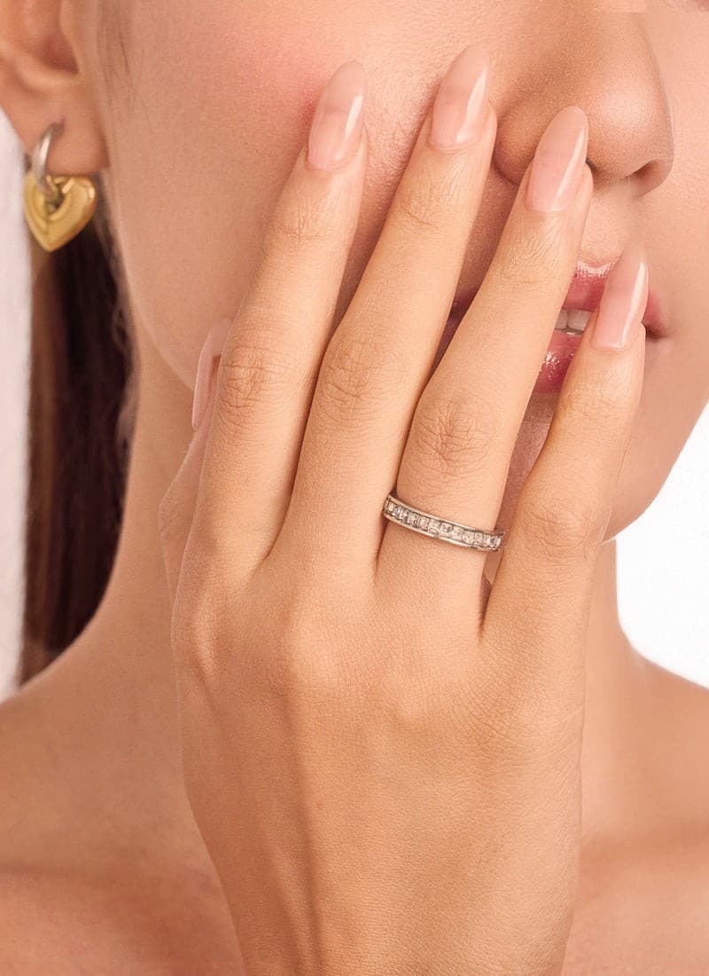 model wearing elegant silver plated crystal band ring by elra