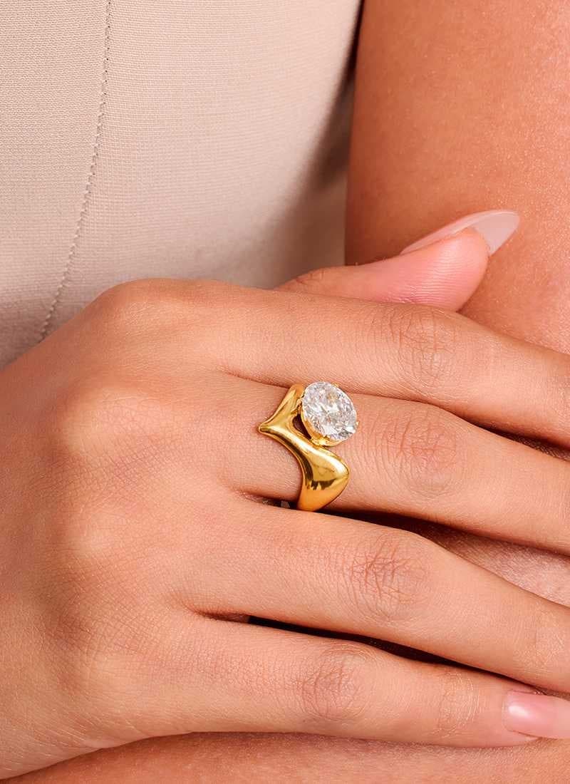 model wearing radiant fold ring in 18k gold plating by Elra.